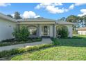 Inviting front entrance with a covered porch and landscaping at 4762 Nw 30Th Pl, Ocala, FL 34482