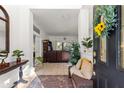 Inviting entryway with seating area and view to living room at 4893 Sw 4Th Cir, Ocala, FL 34471