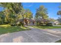 House exterior showcasing landscaping and driveway at 4893 Sw 4Th Cir, Ocala, FL 34471
