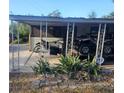 Home with carport and outdoor storage for recreational vehicles at 34828 1St Ave, Leesburg, FL 34788