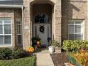 Front door entrance with seasonal decor at 3403 Gatlin Place Cir, Orlando, FL 32812