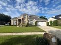 Two story house with large lawn at 3403 Gatlin Place Cir, Orlando, FL 32812