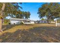 House exterior view, showcasing the front yard and landscaping at 11205 Sw 63Rd Terrace Rd, Ocala, FL 34476