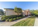 Single-story home with manicured landscaping and walkway at 6743 Sw 91St Cir, Ocala, FL 34481