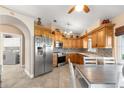 Kitchen with wooden cabinets and stainless steel appliances at 1960 Nw 50Th Cir, Ocala, FL 34482
