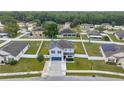 Aerial view of a house with solar panels and a spacious backyard in a quiet neighborhood at 2824 Ne 43Rd Rd, Ocala, FL 34470