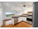 Modern kitchen with stainless steel appliances and breakfast bar at 6042 Topsail Rd, Lady Lake, FL 32159
