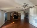 Bright living room with hardwood floors and a view of the kitchen at 8685 Sw 67 Ct, Ocala, FL 34476