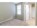 Empty bedroom with neutral walls and carpeted floor at 4555 Sw 52Nd Cir # 101, Ocala, FL 34474