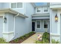 Front entry of townhome with walkway and landscaping at 4555 Sw 52Nd Cir # 101, Ocala, FL 34474