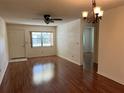 Living room with hardwood floors and ceiling fan at 9460 Sw 84Th Ter # E, Ocala, FL 34481