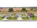 Aerial view of three houses in a neighborhood at 4710 Sw 65Th Pl, Ocala, FL 34474