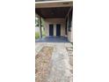 Covered patio with storage and a concrete walkway at 204 Se 30Th Ave, Ocala, FL 34471