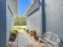 Inviting entryway with a bench and lush landscaping at 227 Locust Pass Crse, Ocala, FL 34472