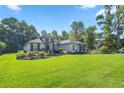 Single story home with stone accents and manicured lawn at 3993 Se 10Th Ave, Ocala, FL 34480