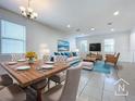 Bright dining area with wood table and seating for six at 6317 Hamlin Reserve Blvd, Winter Garden, FL 34787