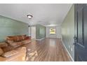 Spacious living room with hardwood floors and a neutral color scheme at 1811 Ne 30Th St, Ocala, FL 34479