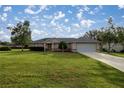 House exterior featuring a one-story home with a garage at 13365 Sw 3Rd Ct, Ocala, FL 34473