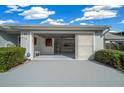 Garage interior with open doors, storage shelving, and ample space at 17789 Se 113Th Ter, Summerfield, FL 34491