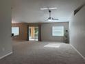 Bright and spacious living room with sliding glass doors leading to a patio at 6250 Sw 116Th Street Rd, Ocala, FL 34476