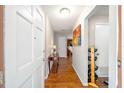 Bright entryway with hardwood floors and console table at 4812 Ne 12Th St, Ocala, FL 34470