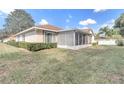 One-story home with screened patio and well-maintained landscaping at 15445 Sw 34Th Court Rd, Ocala, FL 34473