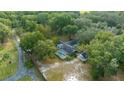 Aerial view showing house, pool, and expansive property at 12860 Ne 36Th Ave, Anthony, FL 32617