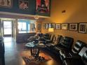 Living room with leather furniture and high ceilings at 3824 Ne 17Th Street Cir, Ocala, FL 34470