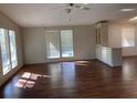 Bright living room with laminate floors and built-in cabinetry at 1125 Paradise Dr # D, Lady Lake, FL 32159