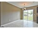 Bright dining area with tile floors and sliding glass doors leading to the backyard at 12809 Sw 83Rd Ter, Ocala, FL 34473