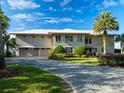 Large home with three-car garage and a nicely landscaped yard at 12757 Se 143Rd Ave, Ocklawaha, FL 32179