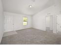 Spacious bedroom with gray carpeting and neutral walls at 2589 Sw Breezy Point Dr, Dunnellon, FL 34431