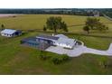 Aerial view showing home, pool, and barn on a large lot at 3550 Sw 210Th Ave, Dunnellon, FL 34431