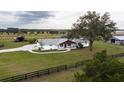 Aerial view of a ranch home on a spacious lot with farm views at 3550 Sw 210Th Ave, Dunnellon, FL 34431