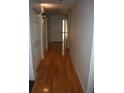 Bright hallway with light wood flooring and access to bedrooms and other rooms at 3706 Ne 16Th Pl, Ocala, FL 34470