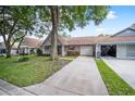 Front view of house with driveway and landscaping at 8814 Sw 93Rd Ln # C, Ocala, FL 34481