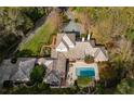 Overhead view of house, pool, and lush landscaping at 1150 Sw 43Rd Pl, Ocala, FL 34471
