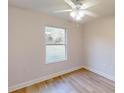 Bright bedroom with light wood flooring and a large window at 1936 Sw Algeries Ct, Dunnellon, FL 34431