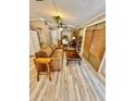 Cozy living room with light brown sofa and wood flooring at 45202 Nfs Rd 572-B, Altoona, FL 32702