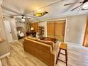 Living area features a comfortable sofa and a wooden coffee table at 45202 Nfs Rd 572-B, Altoona, FL 32702