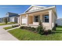 One-story house with light beige siding, gray shutters, and a covered front porch at 6200 Sw 72Nd Ter, Ocala, FL 34474