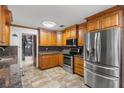 Well-equipped kitchen with wood cabinets and granite countertops at 1520 Ne 39Th St, Ocala, FL 34479