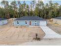 New construction home with a one-car garage and driveway at 15397 Sw 29 St, Ocala, FL 34481