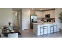 Open concept kitchen with island and dining area at 6612 Sw 81St Loop, Ocala, FL 34476
