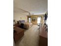 Bright bedroom with a queen-size bed and an ensuite desk at 8120 Nw 47Th Ln, Ocala, FL 34482
