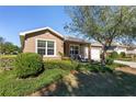 House exterior showcasing landscaping and driveway at 9350 Sw 91St Court Rd, Ocala, FL 34481