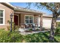 Inviting front porch with seating and landscaping at 9350 Sw 91St Court Rd, Ocala, FL 34481