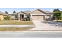 Single-story home with two-car garage and well-maintained landscaping at 9826 Sw 63Rd Loop, Ocala, FL 34481