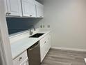 Bright kitchen featuring white cabinets and modern countertops at 10842 Se 50Th Ave # 1, Belleview, FL 34420