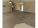 Bright living room with carpet flooring and ceiling fan at 21 Maple Crse, Ocklawaha, FL 32179